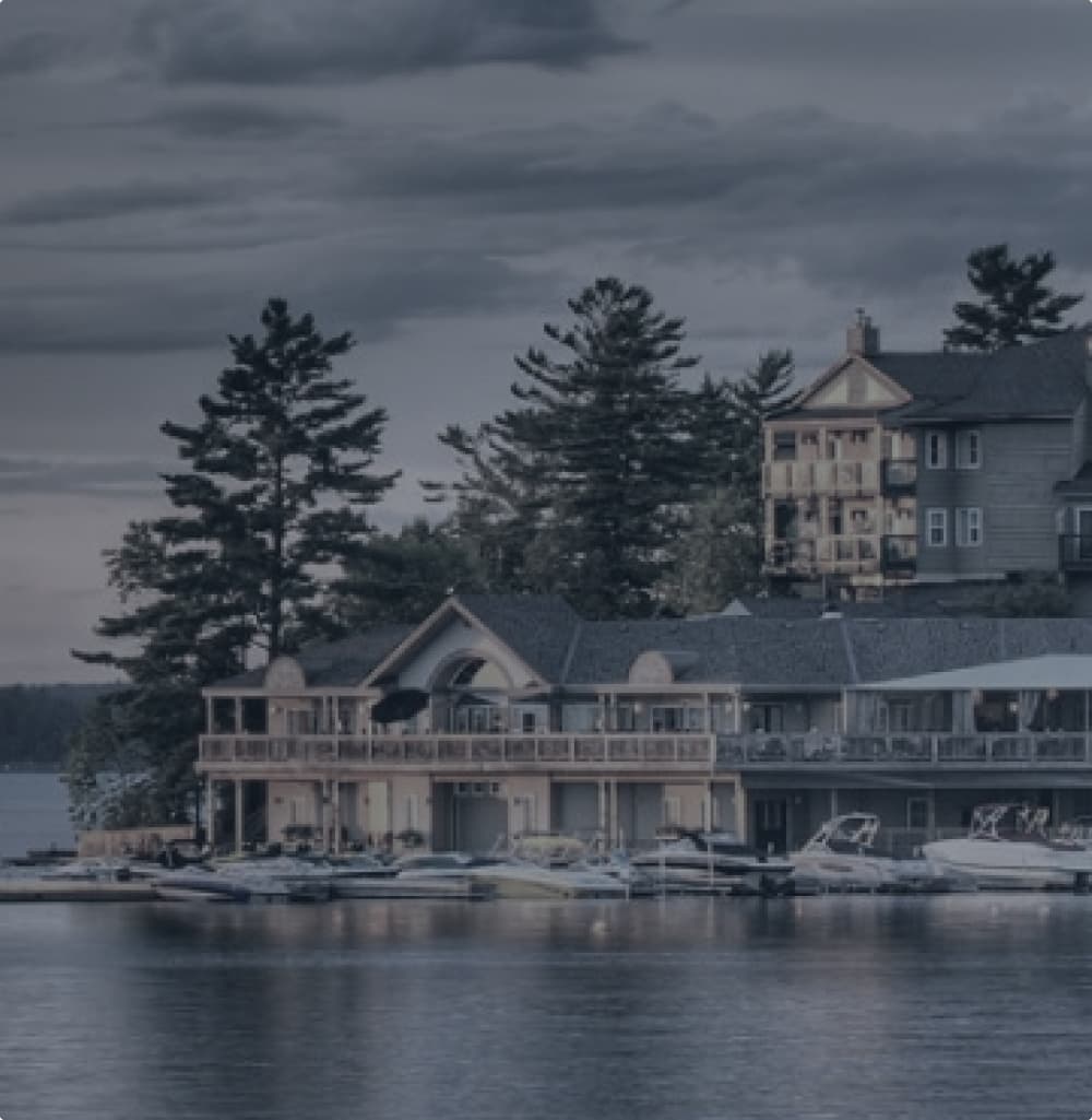 A Tree lined, Lake view of Taboo resort in Muskoka,ON